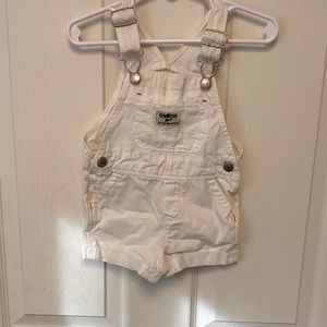 Girls white overalls.